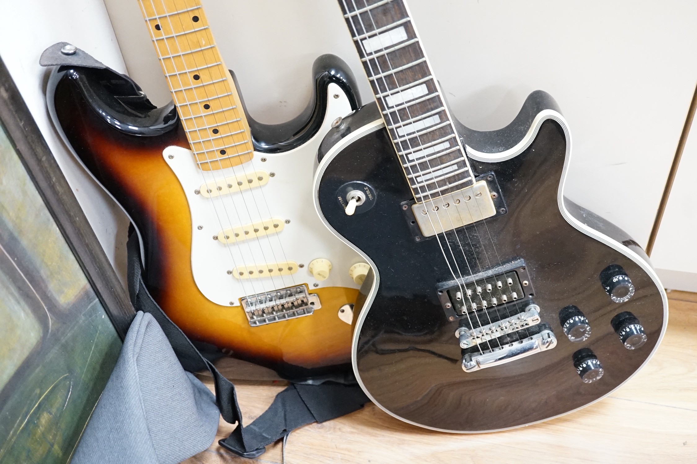 Two electric guitars: a Kay and a Vester Stage series, one soft case